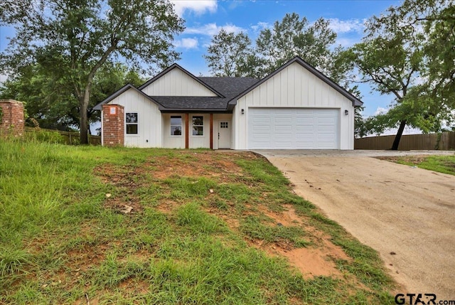 1002 E Main St, Whitehouse, TX 75791 - modern farmhouse with roof with shingles, a garage, and concrete driveway