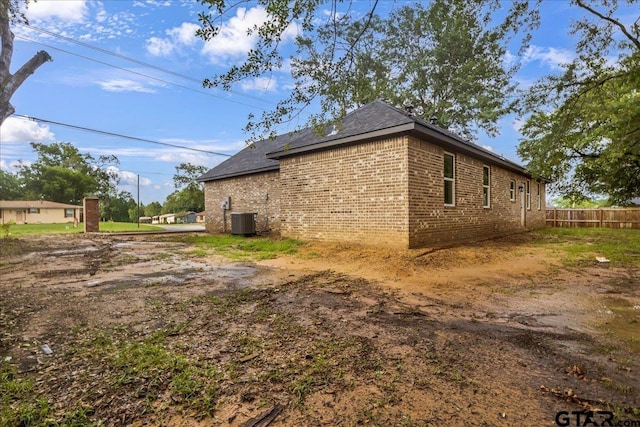 1002 E Main St, Whitehouse, TX 75791 - view of side of property with central AC unit and brick siding