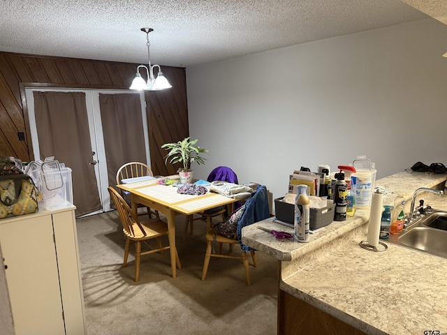 2613 Prestwick Rd # A & B, Jacksonville, TX 75766 - dining space with light carpet, a chandelier, and a textured ceiling