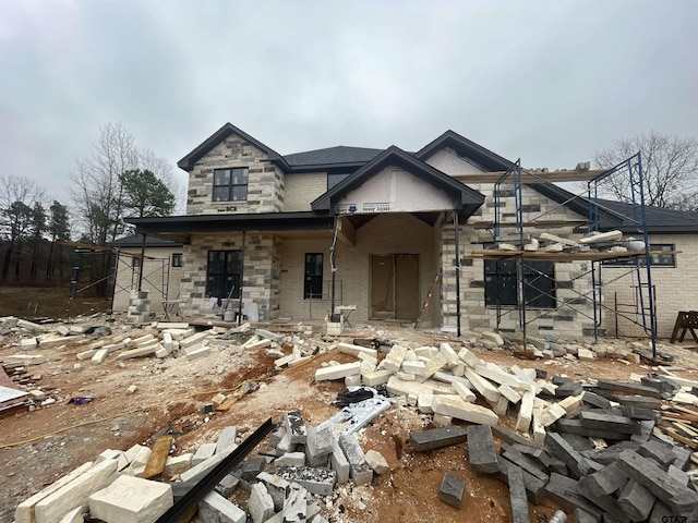 property under construction with stone siding and brick siding