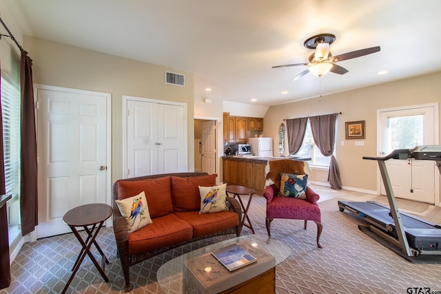 living room featuring ceiling fan and carpet floors