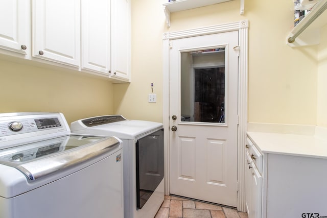 washroom with cabinets and independent washer and dryer