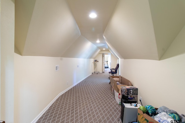 bonus room featuring vaulted ceiling and carpet floors