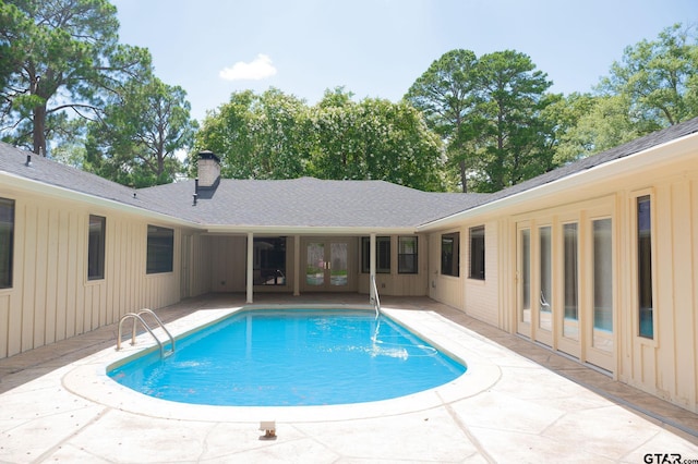4010 Silverwood Dr, Tyler, TX 75701 - outdoor pool with french doors and a patio area
