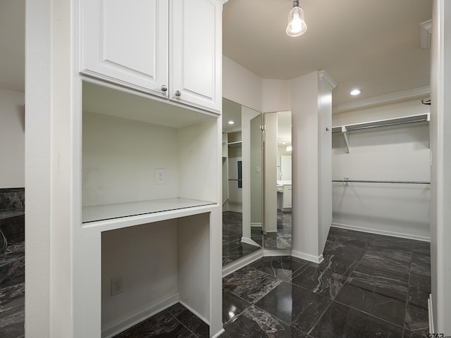 4010 Silverwood Dr, Tyler, TX 75701 - walk in closet featuring dark marble finish flooring