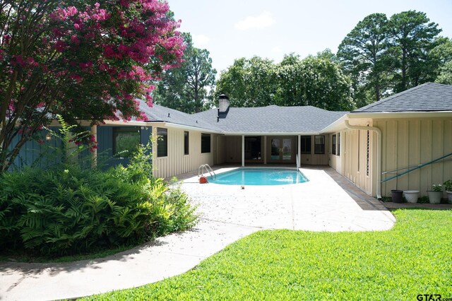 4010 Silverwood Dr, Tyler, TX 75701 - swimming pool with a patio area and a lawn