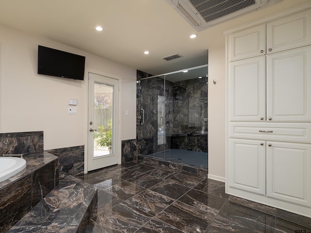 4010 Silverwood Dr, Tyler, TX 75701 - full bathroom featuring marble tiled flooring, a marble finish shower, a bath, and recessed lighting