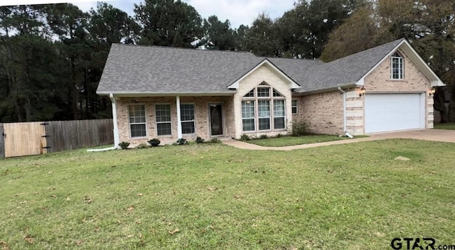 view of front of house with a garage and a front yard