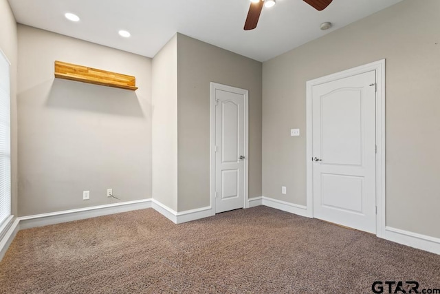 unfurnished bedroom with carpet floors and ceiling fan