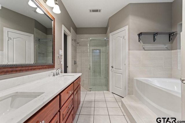 bathroom with tile patterned flooring, vanity, and independent shower and bath