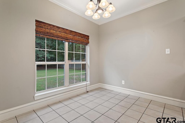 empty room featuring light tile patterned flooring, a chandelier, and ornamental molding