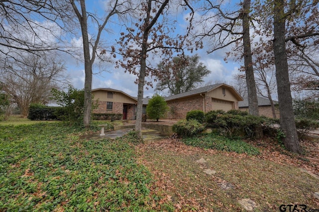 single story home featuring a garage