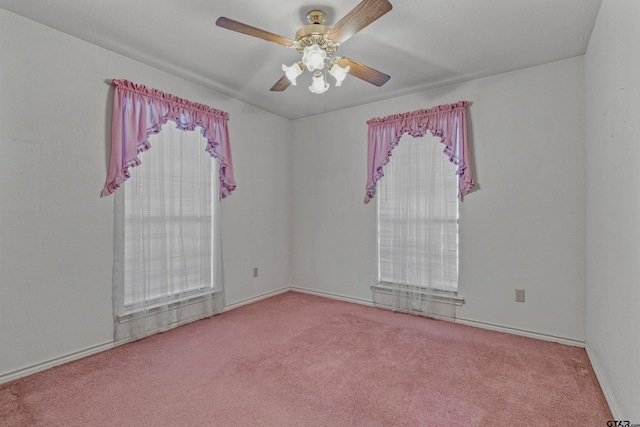 empty room featuring carpet and ceiling fan