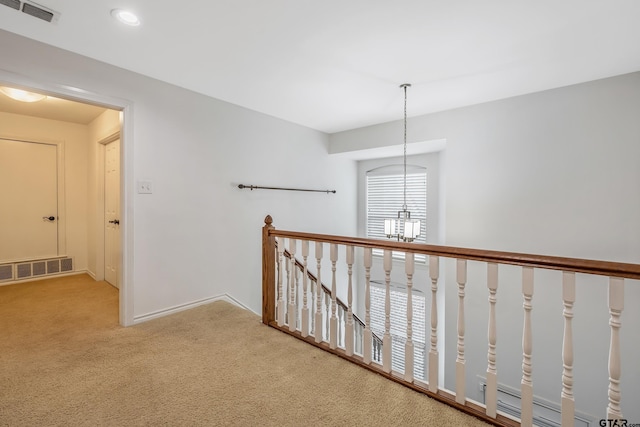 7117 Holly Square Ct, Tyler, TX 75703 - hall featuring carpet flooring, an upstairs landing, a chandelier, baseboards, and recessed lighting