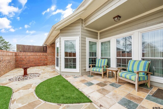 7117 Holly Square Ct, Tyler, TX 75703 - fenced backyard with a patio