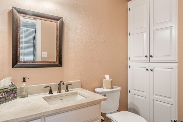 7117 Holly Square Ct, Tyler, TX 75703 - bathroom with vanity, toilet, and a textured wall