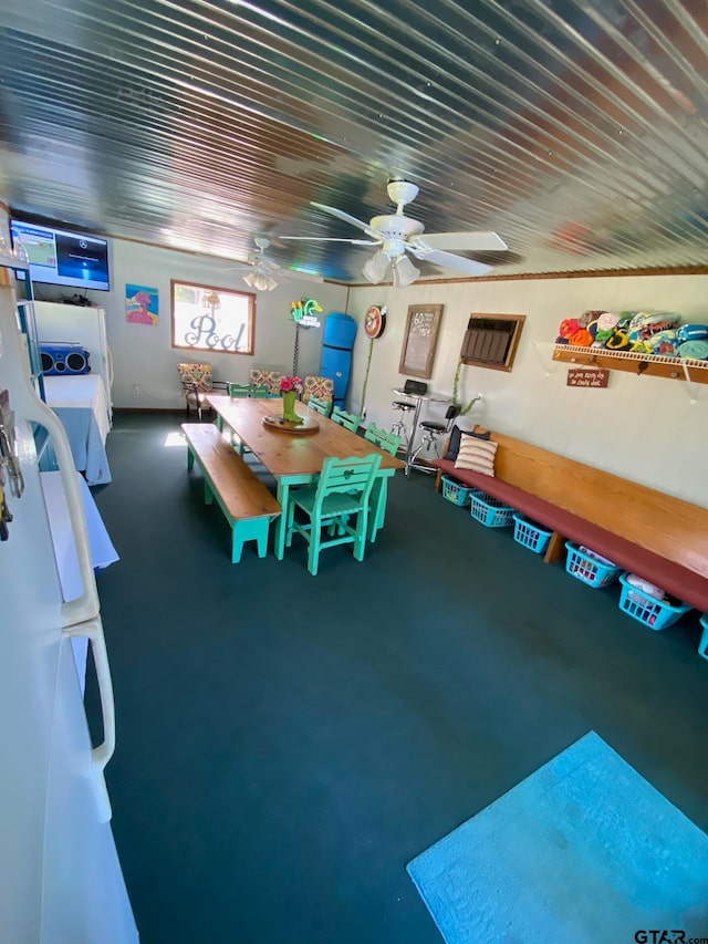 game room featuring ceiling fan and concrete floors