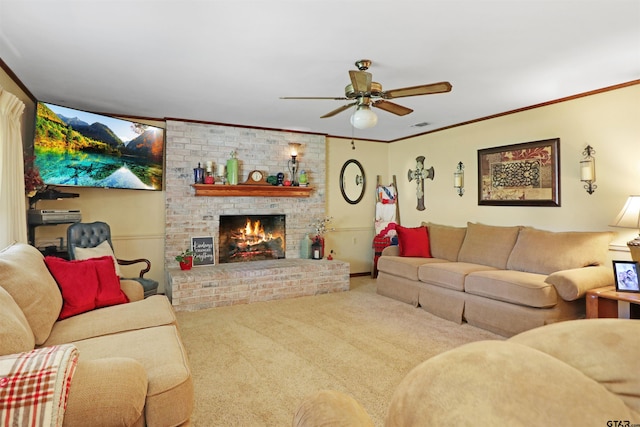 living room with carpet floors, a fireplace, ceiling fan, and crown molding