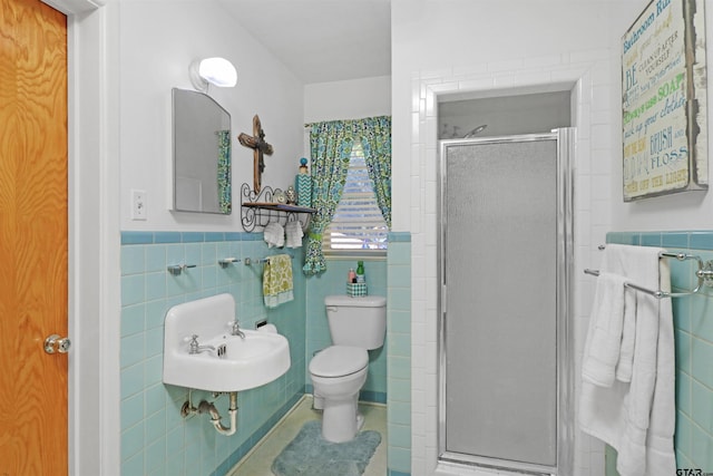 bathroom with toilet, an enclosed shower, tile walls, and tile patterned flooring