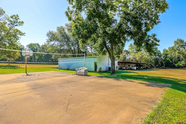 view of home's community with volleyball court and a yard