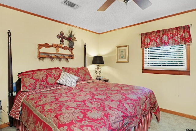 bedroom with ceiling fan, a textured ceiling, light carpet, and crown molding