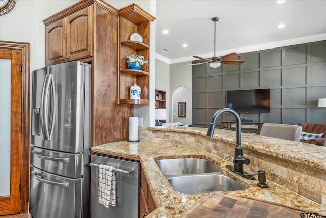 301 Zambezi Ln, Bullard, TX 75757 - kitchen featuring appliances with stainless steel finishes, a sink, a ceiling fan, open shelves, and light stone countertops