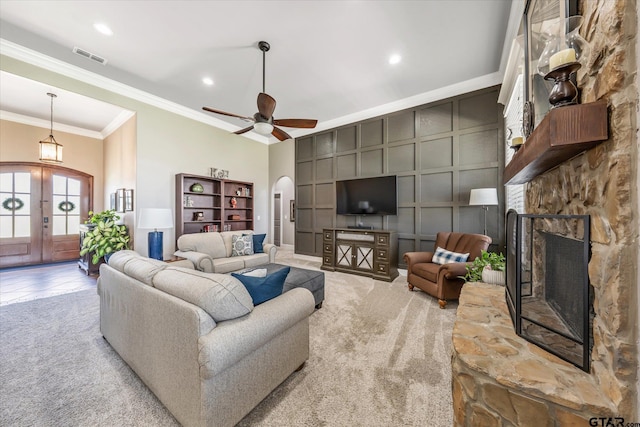 301 Zambezi Ln, Bullard, TX 75757 - living area with a fireplace, arched walkways, crown molding, carpet flooring, and french doors