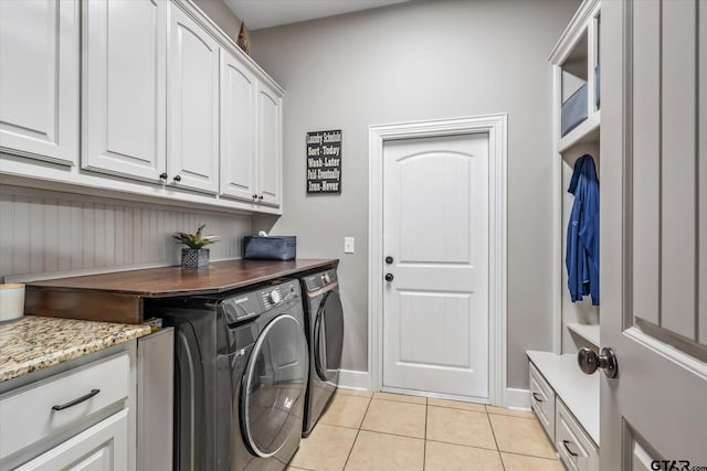 301 Zambezi Ln, Bullard, TX 75757 - laundry area featuring independent washer and dryer, light tile patterned floors, cabinet space, and baseboards