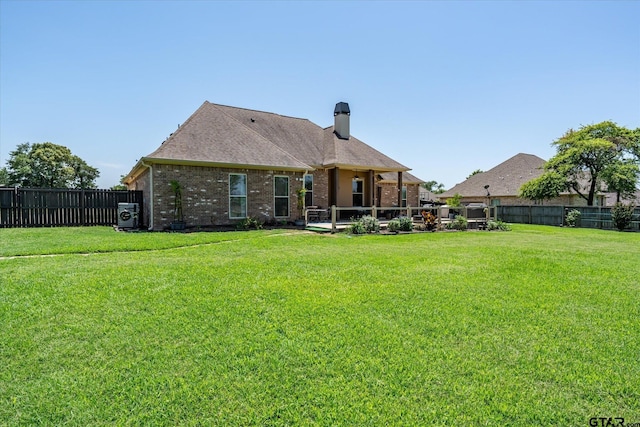 301 Zambezi Ln, Bullard, TX 75757 - rear view of property featuring brick siding, a chimney, and a shingled roof