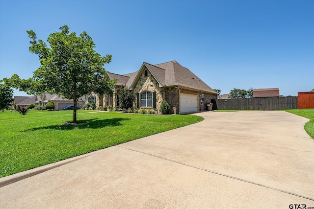 301 Zambezi Ln, Bullard, TX 75757 - french provincial home featuring driveway, stone siding, and an attached garage