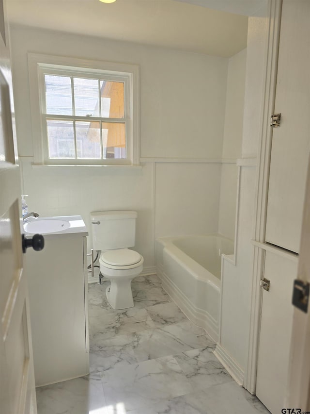 bathroom with toilet and vanity