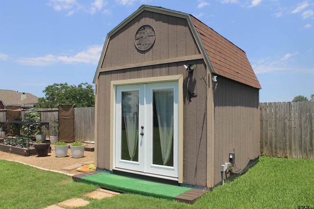 301 Zambezi Ln, Bullard, TX 75757 - view of outbuilding with a fenced backyard, french doors, and a vegetable garden