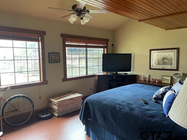 bedroom featuring vaulted ceiling, multiple windows, wooden ceiling, and ceiling fan