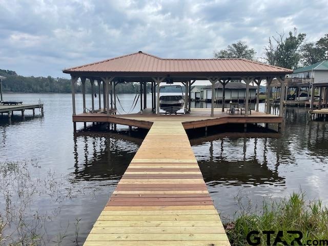 view of dock with a water view