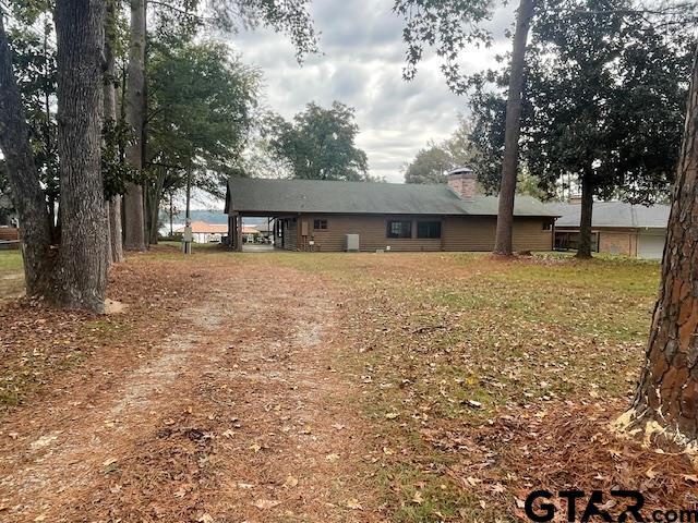 view of yard with a carport