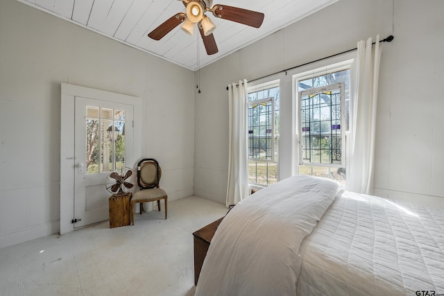 bedroom with multiple windows and ceiling fan