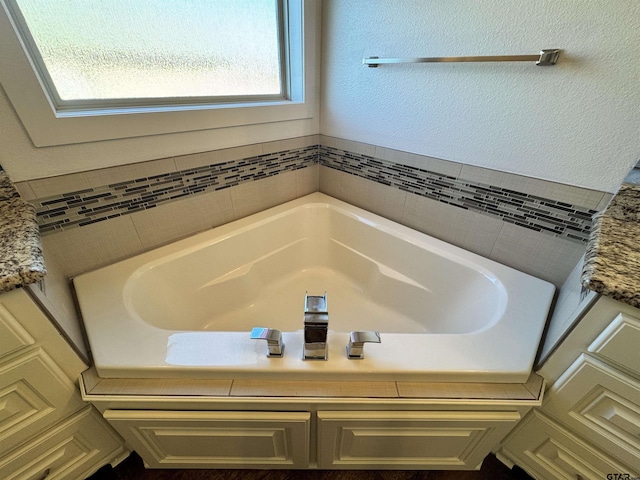 full bath with a garden tub