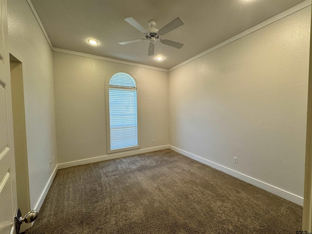 spare room featuring dark colored carpet, a ceiling fan, baseboards, recessed lighting, and ornamental molding