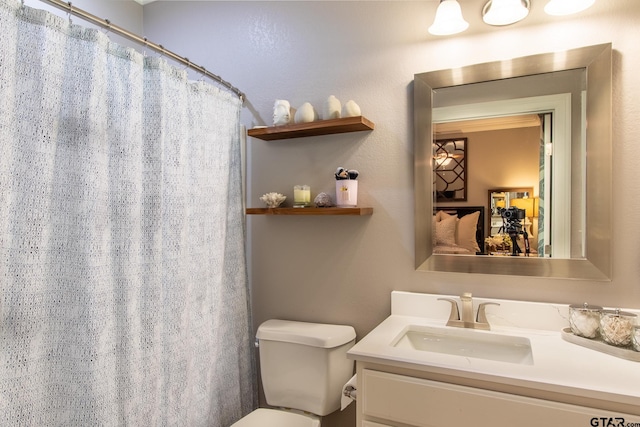 bathroom with vanity and toilet