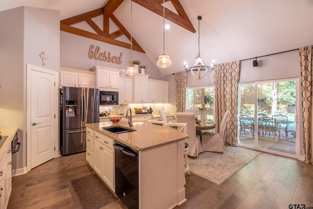 kitchen with black appliances, beam ceiling, high vaulted ceiling, and a kitchen island with sink