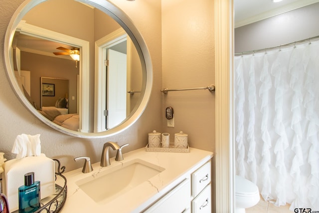 bathroom featuring toilet, vanity, ceiling fan, and crown molding