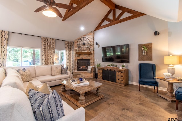 living room featuring beamed ceiling, ceiling fan, high vaulted ceiling, a fireplace, and wood-type flooring