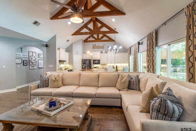 living room featuring high vaulted ceiling, dark hardwood / wood-style flooring, and ceiling fan with notable chandelier