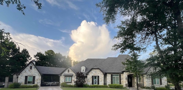 7532 Northlake Dr, Tyler, TX 75703 - french country home featuring stone siding and a front yard