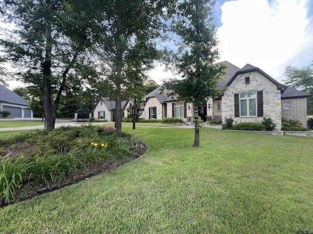 7532 Northlake Dr, Tyler, TX 75703 - view of front of house featuring stone siding and a front yard