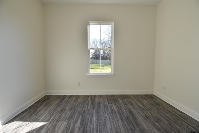 empty room featuring dark hardwood / wood-style floors