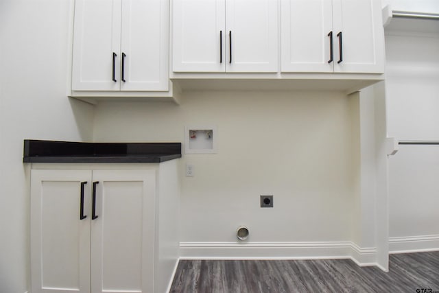 washroom featuring cabinets, washer hookup, dark hardwood / wood-style floors, and hookup for an electric dryer