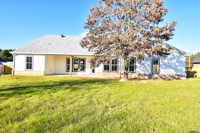 back of property featuring a lawn, a patio area, and ceiling fan