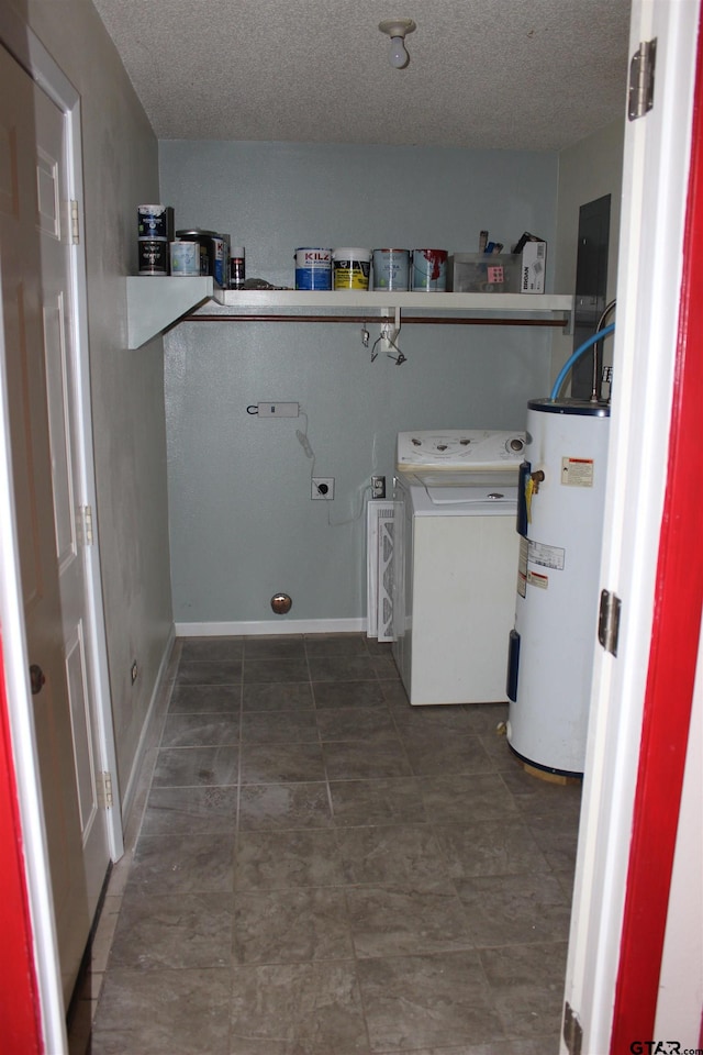 laundry room with electric water heater, a textured ceiling, and washer / clothes dryer