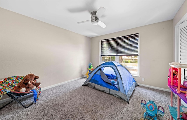 bedroom with ceiling fan and carpet floors